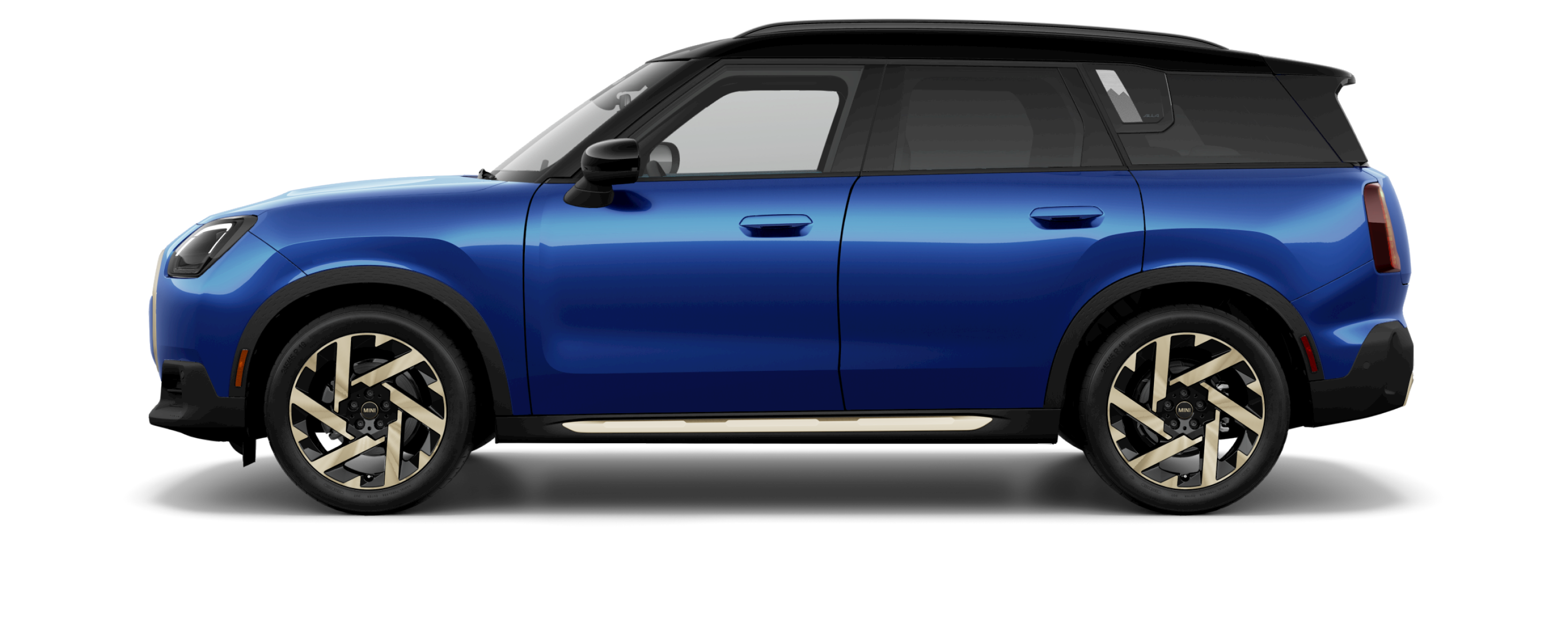 Side view of a 2025 MINI Countryman SE ALL4 in the Blazing Blue body color, facing left with its shadow underneath it